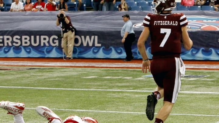 ST. PETERSBURG, FL – DECEMBER 26: Quarterback Nick Fitzgerald #7 of the Mississippi State Bulldogs out runs a Miami (Oh) Redhawks’ defender to score a touchdown during the third quarter in the St. Petersburg Bowl at Tropicana Field on December 26, 2016, in St. Petersburg, Florida. (Photo by Joseph Garnett, Jr. /Getty Images)