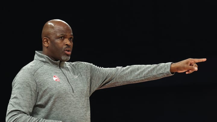 Atlanta Hawks’ head coach Nate McMillan speaks to his players during the NBA pre-season basketball match between the Milwaukee Bucks and the Atlanta Hawks at the Etihad Arena on Yas Island in Abu Dhabi, on October 8, 2022. (Photo by Giuseppe CACACE / AFP) (Photo by GIUSEPPE CACACE/AFP via Getty Images)