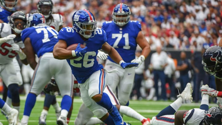 HOUSTON, TX - SEPTEMBER 23: New York Giants Running Back Saquon Barkley (26) looks for running room during the football game between the New York Giants and the Houston Texans on September 23, 2018 at NRG Stadium in Houston, Texas. (Photo by Ken Murray/Icon Sportswire via Getty Images)
