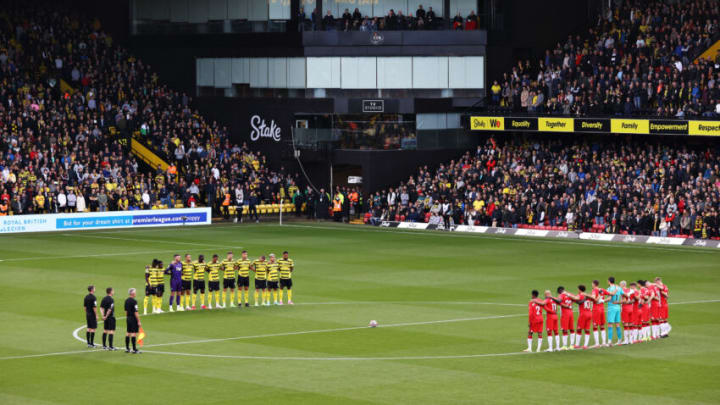 Players, officials and fans observe a minutes silence (Photo by Alex Pantling/Getty Images)