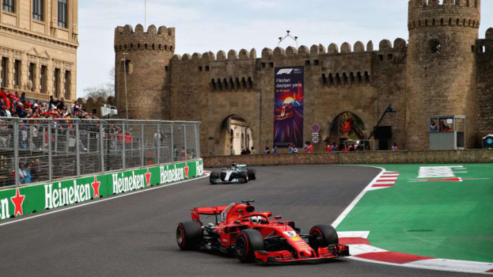 BAKU, AZERBAIJAN - APRIL 29: Sebastian Vettel of Germany driving the (5) Scuderia Ferrari SF71H leads Lewis Hamilton of Great Britain driving the (44) Mercedes AMG Petronas F1 Team Mercedes WO9 on track during the Azerbaijan Formula One Grand Prix at Baku City Circuit on April 29, 2018 in Baku, Azerbaijan. (Photo by Clive Mason/Getty Images)