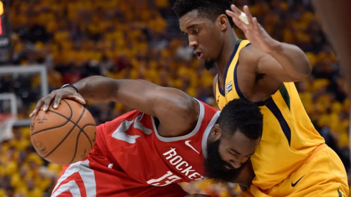 SALT LAKE CITY, UT - MAY 06: James Harden #13 of the Houston Rockets drives into defender Donovan Mitchell #45 of the Utah Jazz in the second half during Game Four of Round Two of the 2018 NBA Playoffs at Vivint Smart Home Arena on May 6, 2018 in Salt Lake City, Utah. The Rockets beat the Jazz 100-87. NOTE TO USER: User expressly acknowledges and agrees that, by downloading and or using this photograph, User is consenting to the terms and conditions of the Getty Images License Agreement. (Photo by Gene Sweeney Jr./Getty Images)