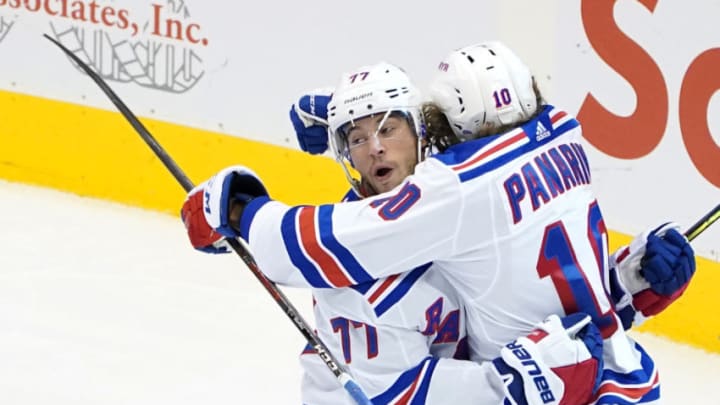 TORONTO, ONTARIO - AUGUST 03: Artemi Panarin #10 of the New York Rangers celebrates with Tony DeAngelo #77 after scoring a goal against the Carolina Hurricanes in Game Two of the Eastern Conference Qualification Round prior to the 2020 NHL Stanley Cup Playoffs at Scotiabank Arena on August 3, 2020 in Toronto, Ontario, Canada. (Photo by Andre Ringuette/Freestyle Photo/Getty Images)