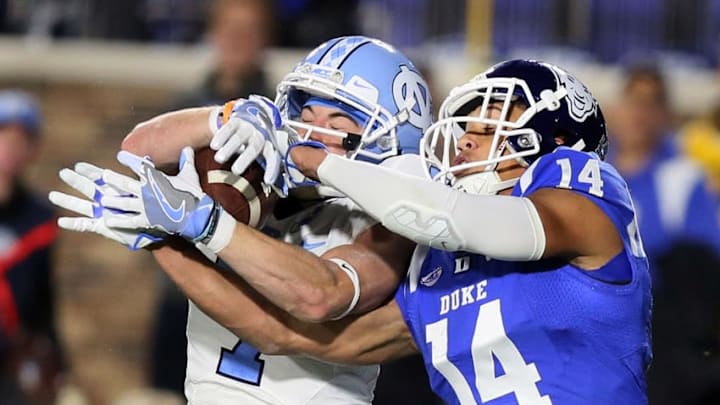 Nov 10, 2016; Durham, NC, USA; Duke Blue Devils cornerback Bryon Fields (14) breaks up a pass intended for North Carolina Tar Heels wide receiver Austin Proehl (7) in the end zone in the first half of their game at Wallace Wade Stadium. Mandatory Credit: Mark Dolejs-USA TODAY Sports