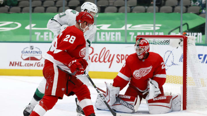 DALLAS, TEXAS - APRIL 19: Jason Robertson #21 of the Dallas Stars scores a goal against Thomas Greiss #29 of the Detroit Red Wings in the second period at American Airlines Center on April 19, 2021 in Dallas, Texas. (Photo by Tom Pennington/Getty Images)
