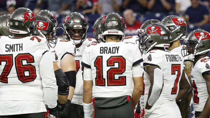 HOUSTON, TEXAS - AUGUST 28: Tom Brady #12 of the Tampa Bay Buccaneers huddles his offense against the Houston Texans during a NFL preseason game at NRG Stadium on August 28, 2021 in Houston, Texas. (Photo by Bob Levey/Getty Images)