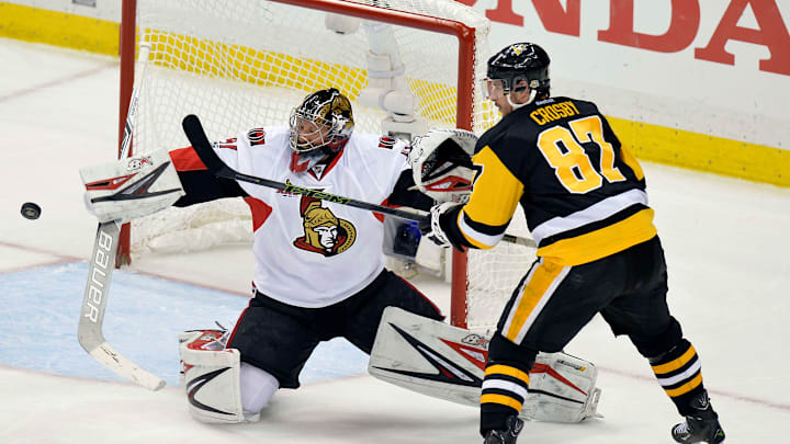 May 25, 2017; Pittsburgh, PA, USA; Pittsburgh Penguins center Sidney Crosby (87) tries to tip the puck past Ottawa Senators goalie Craig Anderson (41) during the first overtime period in game seven of the Eastern Conference Final of the 2017 Stanley Cup Playoffs at PPG PAINTS Arena. Mandatory Credit: Don Wright-USA TODAY Sports