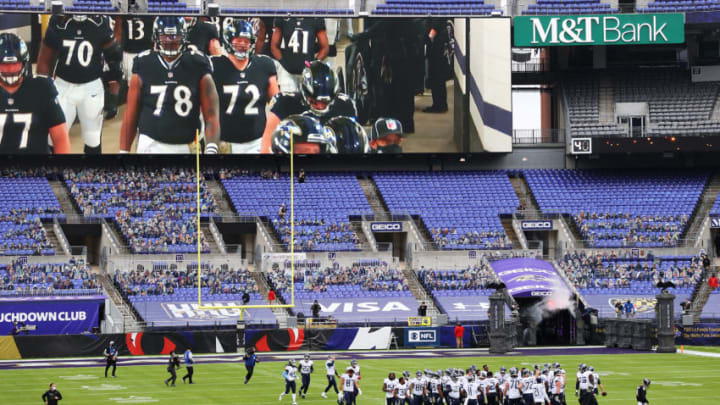 BALTIMORE, MARYLAND - NOVEMBER 22: The Baltimore Ravens meet on the field before the game against the Tennessee Titans at M&T Bank Stadium on November 22, 2020 in Baltimore, Maryland. (Photo by Rob Carr/Getty Images)