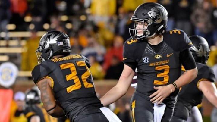 Nov 5, 2015; Columbia, MO, USA; Missouri Tigers quarterback Drew Lock (3) hands the ball off to Missouri Tigers running back Russell Hansbrough (32) against the Mississippi State Bulldogs during the second half at Faurot Field. Mississippi State defeated Missouri 31-13. Mandatory Credit: Jasen Vinlove-USA TODAY Sports