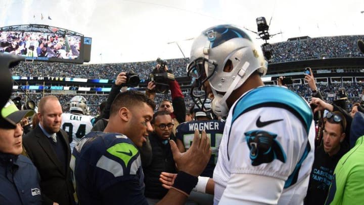 Jan 17, 2016; Charlotte, NC, USA; Seattle Seahawks quarterback Russell Wilson (3) and Carolina Panthers quarterback Cam Newton (1) shake hands after a NFC Divisional round playoff game at Bank of America Stadium. The Panthers defeated the Seahawks 31-24. Mandatory Credit: Kirby Lee-USA TODAY Sports