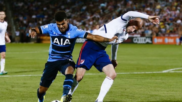 Jul 29, 2015; Denver, CO, USA; Tottenham Hotspur defender DeAndre Yedlin (12) and MLS All Stars defender Laurent Ciman (6) of the Montreal Impact battle for the ball in the second half of the 2015 MLS All Star Game at Dick