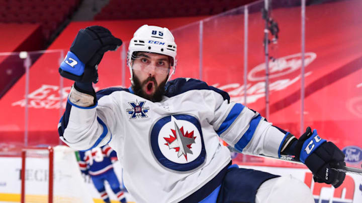 MONTREAL, QC - MARCH 04: Mathieu Perreault #85 of the Winnipeg Jets reacts as he celebrates his goal during the first period against the Montreal Canadiens at the Bell Centre on March 4, 2021 in Montreal, Canada. (Photo by Minas Panagiotakis/Getty Images)