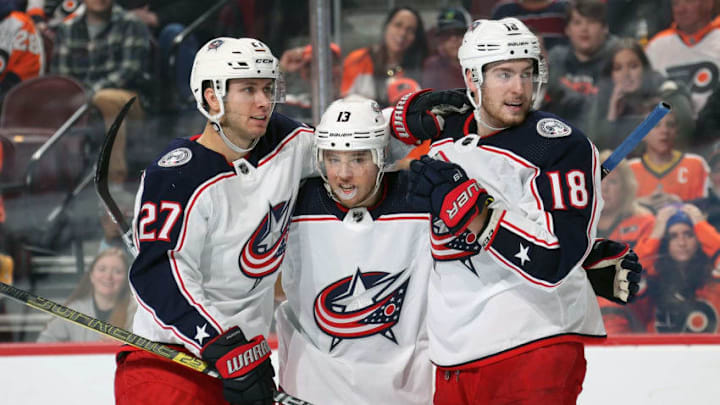PHILADELPHIA, PA - DECEMBER 22: Cam Atkinson #13 of the Columbus Blue Jackets celebrates the first of his two second period goals against the Philadelphia Flyers with Ryan Murray #27 and Pierre-Luc Dubois #18 on December 22, 2018 at the Wells Fargo Center in Philadelphia, Pennsylvania. (Photo by Len Redkoles/NHLI via Getty Images)