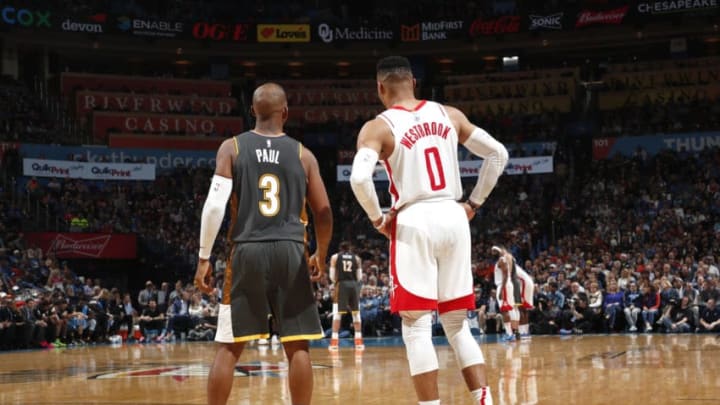 JANUARY 9: Chris Paul #3 of the OKC Thunder and Russell Westbrook #0 of the Houston Rockets looks on during the game (Photo by Jeff Haynes/NBAE via Getty Images)