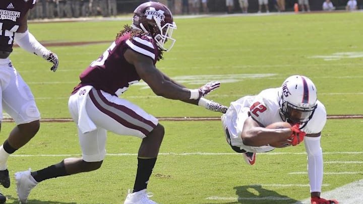 Sep 3, 2016; Starkville, MS, USA; South Alabama Jaguars tight end Gerald Everett (12) dives out of bounds as he is defended by Mississippi State Bulldogs defensive back Lashard Durr (25) during the second quarter of the game at Davis Wade Stadium. Mandatory Credit: Matt Bush-USA TODAY Sports
