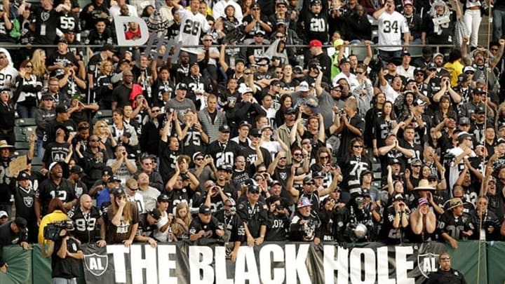 August 25, 2012; Oakland, CA, USA; Fans in the Black Hole cheer during action between the Oakland Raiders and the Detroit Lions in the fourth quarter at O.co Coliseum. The Raiders defeated the Lions 31-20. Mandatory Credit: Cary Edmondson-USA TODAY Sports