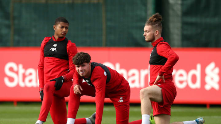 LIVERPOOL, ENGLAND - OCTOBER 22: Rhian Brewster, Neco Williams and Harvey Elliott warm up during a Liverpool training session ahead of the Champions League group E match against KRC Genk at Melwood Training Ground on October 22, 2019 in Liverpool, England. (Photo by Jan Kruger/Getty Images)