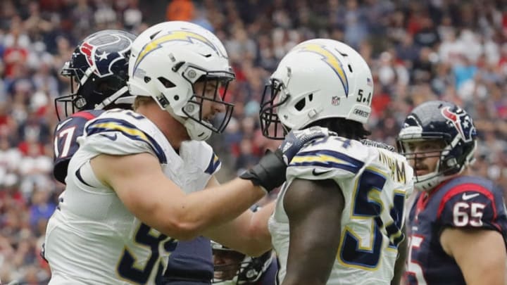 HOUSTON, TX - NOVEMBER 27: Joey Bosa #99 of the San Diego Chargers celebrates with Melvin Ingram #54 after a sack against the Houston Texans at NRG Stadium on November 27, 2016 in Houston, Texas. (Photo by Tim Warner/Getty Images)