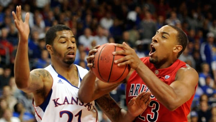 LAS VEGAS - NOVEMBER 27: Markieff Morris #21 of the Kansas Jayhawks fouls Derrick Williams #23 of the Arizona Wildcats during the championship game of the Las Vegas Invitational at The Orleans Arena November 27, 2010 in Las Vegas, Nevada. Kansas won 87-79. (Photo by Ethan Miller/Getty Images)