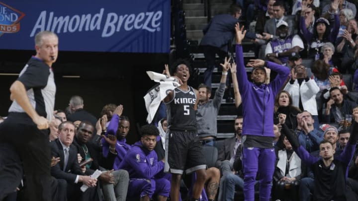 SACRAMENTO, CA - DECEMBER 14: De'Aaron Fox #5 of the Sacramento Kings reacts from the bench during the game against the Golden State Warriors on December 14, 2018 at Golden 1 Center in Sacramento, California. NOTE TO USER: User expressly acknowledges and agrees that, by downloading and or using this Photograph, user is consenting to the terms and conditions of the Getty Images License Agreement. Mandatory Copyright Notice: Copyright 2018 NBAE (Photo by Rocky Widner/NBAE via Getty Images)