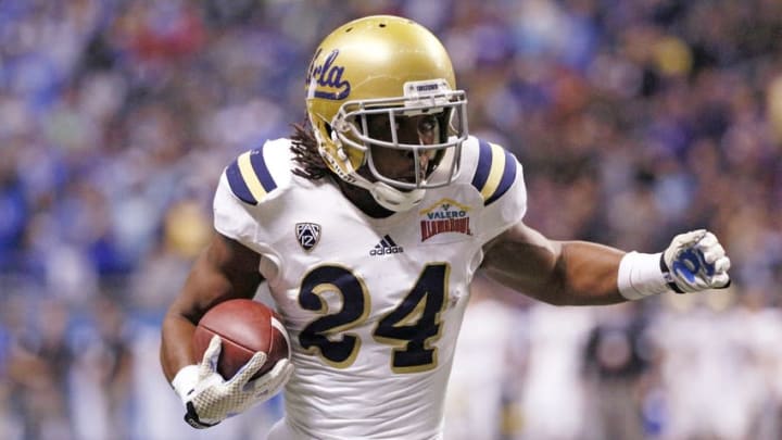 Jan 2, 2015; San Antonio, TX, USA; UCLA Bruins running back Paul Perkins (24) runs after a catch during the second half of the 2015 Alamo Bowl against the Kansas State Wildcats at Alamodome. The Bruins won 40-35. Mandatory Credit: Soobum Im-USA TODAY Sports