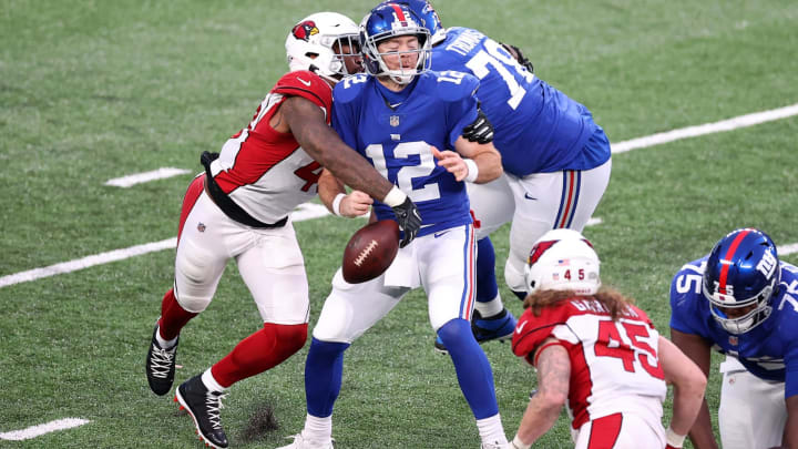 EAST RUTHERFORD, NEW JERSEY – DECEMBER 13: Linebacker Haason Reddick #43 of the Arizona Cardinals forces a fumble against quarterback Colt McCoy #12 of the New York Giants in the fourth quarter of the game at MetLife Stadium on December 13, 2020 in East Rutherford, New Jersey. The Cardinals recovered the fumble. (Photo by Al Bello/Getty Images)