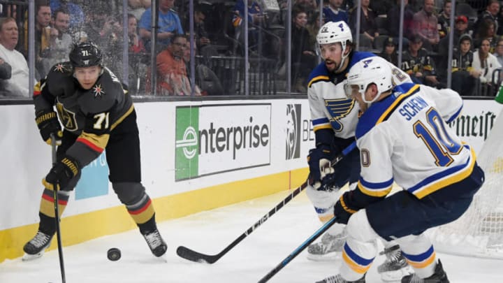 William Karlsson #71 of the Vegas Golden Knights passes against Justin Faulk #72 and Brayden Schenn #10 of the St. Louis Blues. (Photo by Ethan Miller/Getty Images)