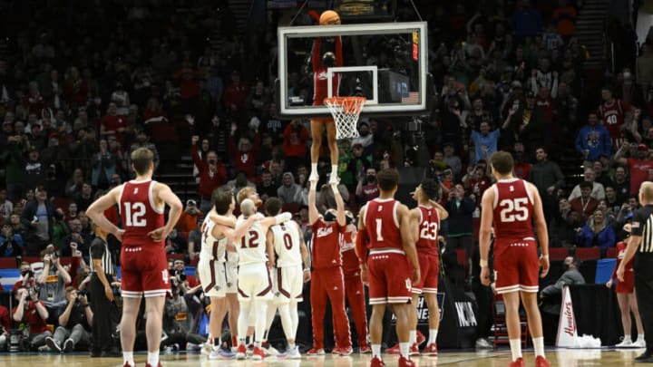 Mar 17, 2022; Portland, OR, USA; Indiana Hoosiers cheerleaders retrieve the basketball against the Saint Mary's Gaels during the second half during the first round of the 2022 NCAA Tournament at Moda Center. Mandatory Credit: Troy Wayrynen-USA TODAY Sports