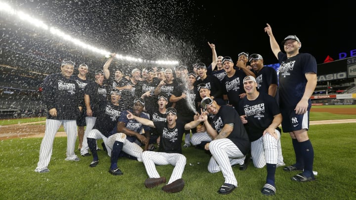 NEW YORK, NEW YORK – SEPTEMBER 19: The New York Yankees celebrate after they clinched the American League East Division with a 9-1 win over the Los Angeles Angels at Yankee Stadium on September 19, 2019 in Bronx borough of New York City. (Photo by Elsa/Getty Images)