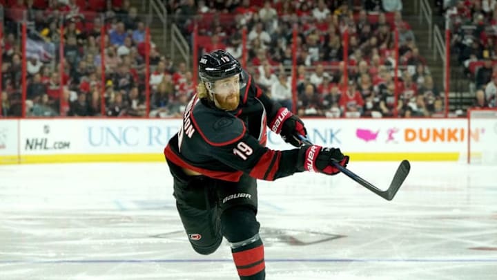 RALEIGH, NC - MAY 16: Dougie Hamilton #19 of the Carolina Hurricanes shoots the puck in Game Four of the Eastern Conference Third Round against the Boston Bruins during the 2019 NHL Stanley Cup Playoffs on May 16, 2019 at PNC Arena in Raleigh, North Carolina. (Photo by Gregg Forwerck/NHLI via Getty Images)