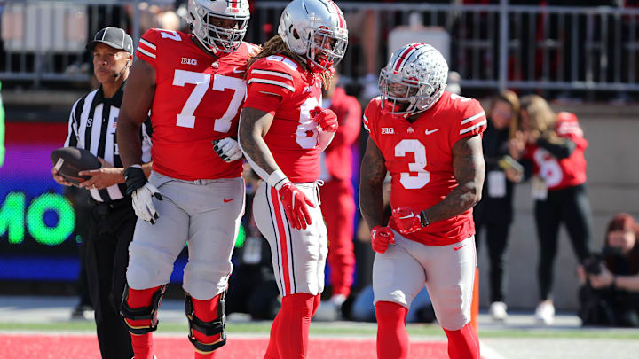 Oct 22, 2022; Columbus, Ohio, USA; Ohio State Buckeyes running back Miyan Williams (3) celebrates his touchdown with offensive lineman Paris Johnson Jr. (77) and tight end Gee Scott Jr. (88) during the first quarter against the Iowa Hawkeyes at Ohio Stadium. Mandatory Credit: Joseph Maiorana-USA TODAY Sports