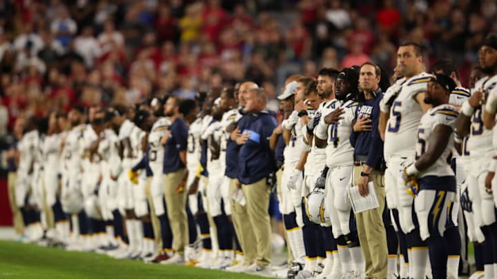GLENDALE, AZ - AUGUST 11: The Los Angeles Chargers stand attended for the national anthem before the preseason NFL game against the Arizona Cardinals at University of Phoenix Stadium on August 11, 2018 in Glendale, Arizona. (Photo by Christian Petersen/Getty Images)