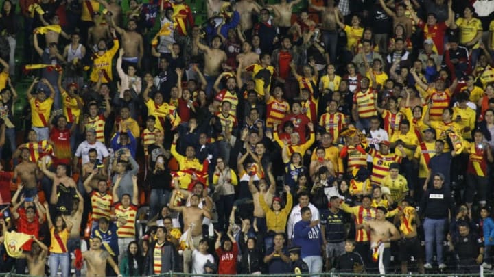 Morelia fans celebrate after their Monarcas pulled off a stunning upset over León in the Apertura 2019 playoffs. Their cheers have now turned to sorrow after team officials announced on June 2 that the franchise is moving to Mazatlán. (Photo by Leopoldo Smith/Getty Images)