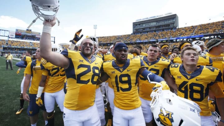 MORGANTOWN, WV - SEPTEMBER 03: West Virginia Mountaineers players celebrate after the game against the Missouri Tigers at Milan Puskar Stadium on September 3, 2016 in Morgantown, West Virginia. West Virginia defeated Missouri 26-11. (Photo by Joe Robbins/Getty Images)
