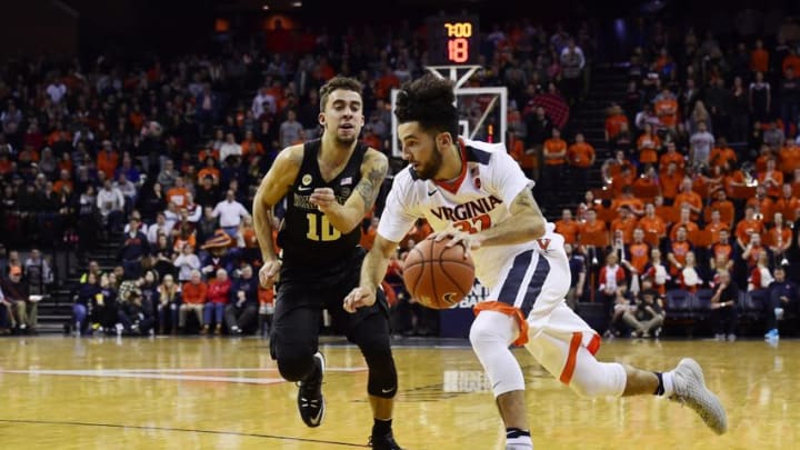 Jan 8, 2017; Charlottesville, VA, USA; Virginia Cavaliers guard London Perrantes (32) dribbles the ball against Wake Forest Demon Deacons guard Mitchell Wilbekin (10) in the second half during a game at John Paul Jones Arena. The Cavaliers defeated the Demon Deacons 79-62. Mandatory Credit: Patrick McDermott-USA TODAY Sports