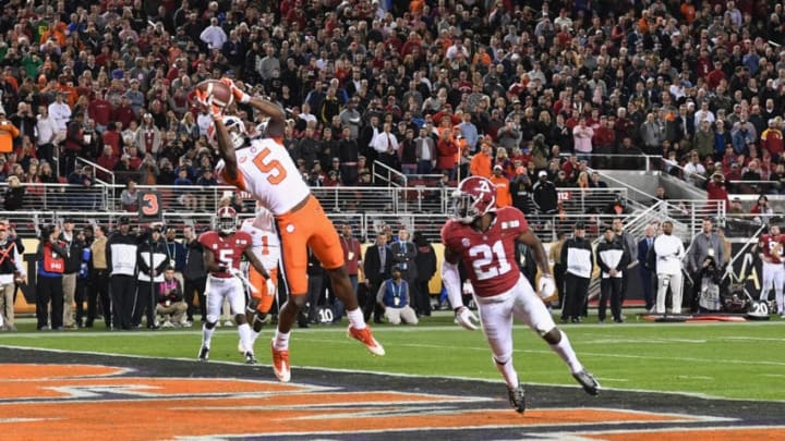 SANTA CLARA, CA - JANUARY 07: Tee Higgins #5 of the Clemson Tigers makes a third quarter touchdown catch against the Alabama Crimson Tide in the CFP National Championship presented by AT&T at Levi's Stadium on January 7, 2019 in Santa Clara, California. (Photo by Thearon W. Henderson/Getty Images)