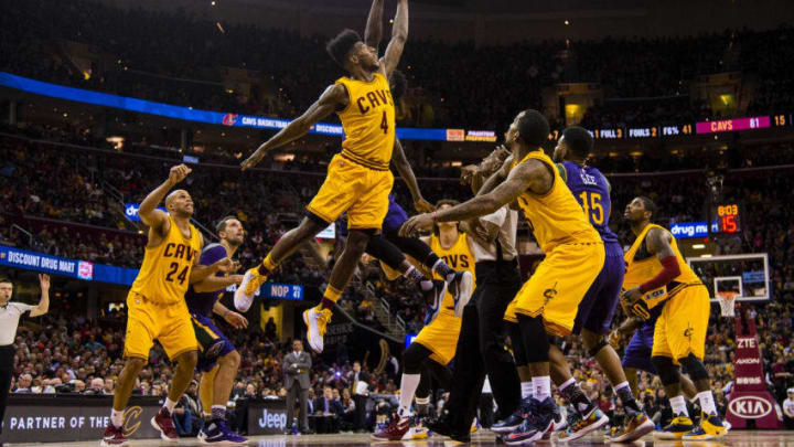 CLEVELAND, OH - FEBRUARY 6: Iman Shumpert #4 of the Cleveland Cavaliers and Jrue Holiday #11 of the New Orleans Pelicans reach for a jump ball during the second half at Quicken Loans Arena on February 6, 2016 in Cleveland, Ohio. The Cavaliers defeated the Pelicans 99-84. NOTE TO USER: User expressly acknowledges and agrees that, by downloading and/or using this photograph, user is consenting to the terms and conditions of the Getty Images License Agreement. Mandatory copyright notice. (Photo by Jason Miller/Getty Images)