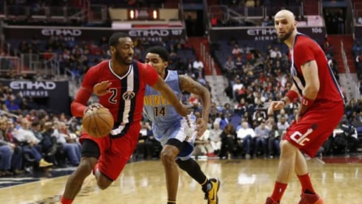 Jan 28, 2016; Washington, DC, USA; Washington Wizards guard John Wall (2) dribbles the ball as Denver Nuggets guard Gary Harris (14) defends in the third quarter at Verizon Center. The Nuggets won 117-113. Mandatory Credit: Geoff Burke-USA TODAY Sports