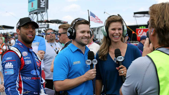 LONG POND, PA - JUNE 10: Ricky Stenhouse Jr., driver of the #17 Little Hug Ford, assists Jamie Little (R) with the Fox Sports broadcast during the NASCAR XFINITY Series Pocono Green 250 at Pocono Raceway on June 10, 2017 in Long Pond, Pennsylvania. (Photo by Jerry Markland/Getty Images)