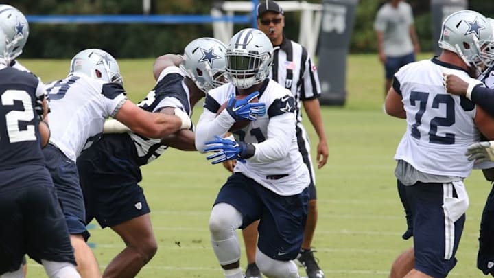 Jun 14, 2016; Irving, TX, USA; Dallas Cowboys running back Ezekiel Elliott (21) runs with the ball during minicamp at Dallas Cowboys Headquarters. Mandatory Credit: Matthew Emmons-USA TODAY Sports