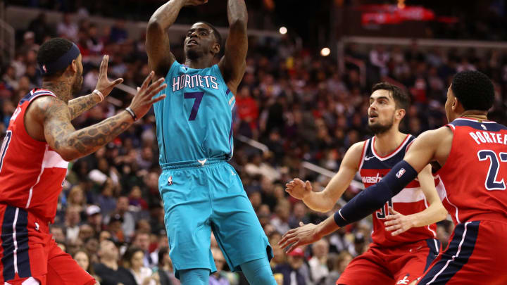 WASHINGTON, DC – MARCH 31: Dwayne Bacon #7 of the Charlotte Hornets shoots in front of Mike Scott #30 of the Washington Wizards during the second half at Capital One Arena on March 31, 2018 in Washington, DC. NOTE TO USER: User expressly acknowledges and agrees that, by downloading and or using this photograph, User is consenting to the terms and conditions of the Getty Images License Agreement. (Photo by Patrick Smith/Getty Images)