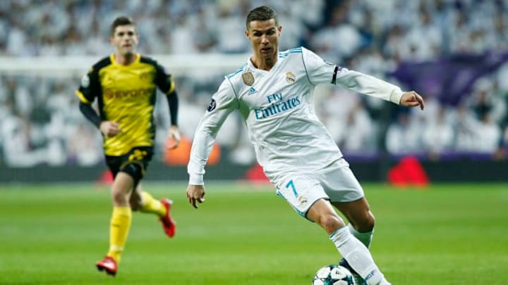MADRID, SPAIN - DECEMBER 06: Cristiano Ronaldo of Real Madrid runs with the ball during the UEFA Champions League group H match between Real Madrid and Borussia Dortmund at Estadio Santiago Bernabeu on December 6, 2017 in Madrid, Spain. (Photo by Gonzalo Arroyo Moreno/Getty Images)