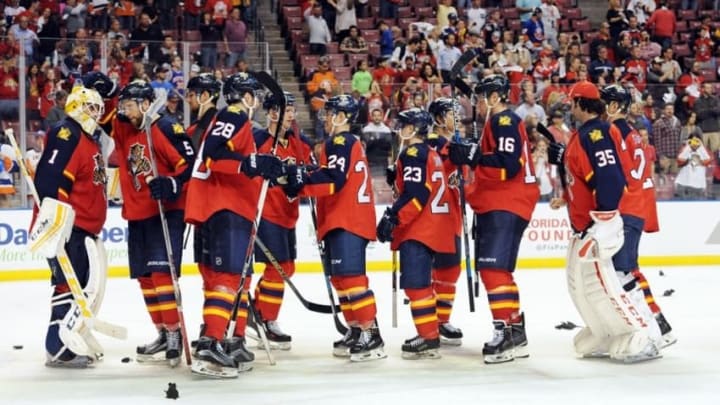 Apr 15, 2016; Sunrise, FL, USA;The Florida Panthers line up to congratulate goalie Roberto Luongo (1) after defeating the New York Islanders 3-1 in game two of the first round of the 2016 Stanley Cup Playoffs at BB&T Center. Mandatory Credit: Robert Duyos-USA TODAY Sports