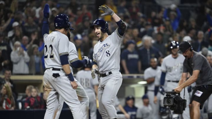 SAN DIEGO, CA - MARCH 30: Ryan Braun #8 of the Milwaukee Brewers is congratulated by Christian Yelich #22 after hitting a three-run home run during the ninth inning of a baseball game against the San Diego Padres at PETCO Park on March 30, 2018 in San Diego, California. (Photo by Denis Poroy/Getty Images)