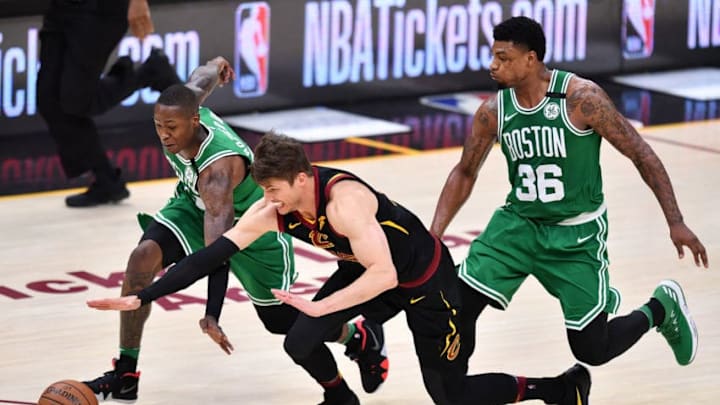 CLEVELAND, OH - MAY 21: Kyle Korver #26 of the Cleveland Cavaliers competes for a loose ball against Terry Rozier #12 and Marcus Smart #36 of the Boston Celtics in the second half during Game Four of the 2018 NBA Eastern Conference Finals at Quicken Loans Arena on May 21, 2018 in Cleveland, Ohio. NOTE TO USER: User expressly acknowledges and agrees that, by downloading and or using this photograph, User is consenting to the terms and conditions of the Getty Images License Agreement. (Photo by Jamie Sabau/Getty Images)