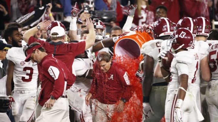 Jan 11, 2016; Glendale, AZ, USA; Alabama Crimson Tide head coach Nick Saban is dunked with Gatorade by his team members in the fourth quarter against the Clemson Tigers in the 2016 CFP National Championship at University of Phoenix Stadium. Mandatory Credit: Rob Schumacher/Arizona Republic via USA TODAY Sports