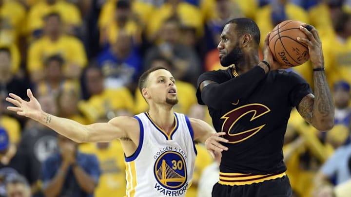 Jun 19, 2016; Oakland, CA, USA; Cleveland Cavaliers forward LeBron James (23) handles the ball against Golden State Warriors guard Stephen Curry (30) during the third quarter in game seven of the NBA Finals at Oracle Arena. Mandatory Credit: Bob Donnan-USA TODAY Sports