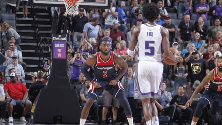 SACRAMENTO, CA - OCTOBER 26: John Wall #2 of the Washington Wizards defends against De'Aaron Fox #5 of the Sacramento Kings on October 26, 2018 at Golden 1 Center in Sacramento, California. NOTE TO USER: User expressly acknowledges and agrees that, by downloading and or using this photograph, User is consenting to the terms and conditions of the Getty Images Agreement. Mandatory Copyright Notice: Copyright 2018 NBAE (Photo by Rocky Widner/NBAE via Getty Images)