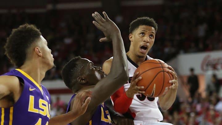 Feb 25, 2017; Athens, GA, USA; Georgia Bulldogs guard J.J. Frazier (30) in action against LSU Tigers forwards Duop Reath (1) and Wayde Sims (44) during the second half at Stegeman Coliseum. UGA defeated LSU 82-80. Mandatory Credit: Adam Hagy-USA TODAY Sports