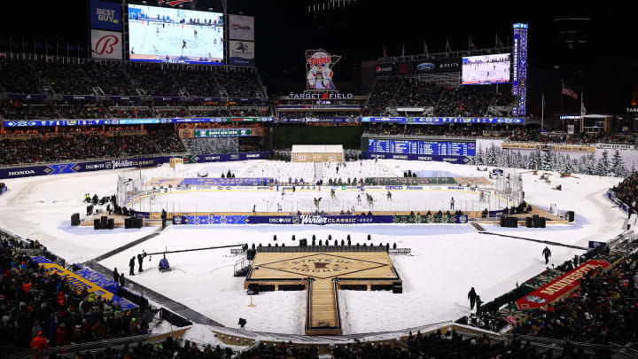 MINNEAPOLIS, MINNESOTA – JANUARY 01: An overview of action on the rink in the first period of the game between the St. Louis Blues and the Minnesota Wild during the NHL Winter Classic game between the St. Louis Blues and the Minnesota Wild at Target Field on January 01, 2022 in Minneapolis, Minnesota. (Photo by Harrison Barden/Getty Images)